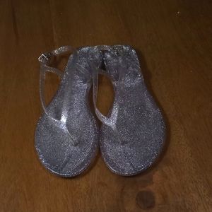 Silver glitter, hard shell sandals.